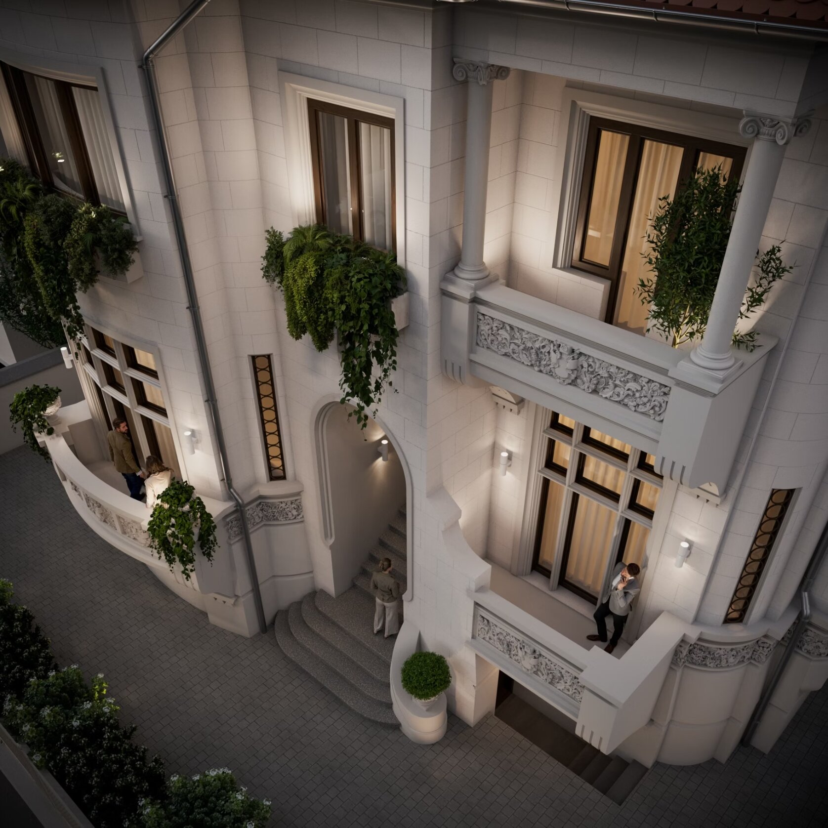 Elevated dusk view of Paris 39 showing the balcony details, interior lighting, and figures in the courtyard