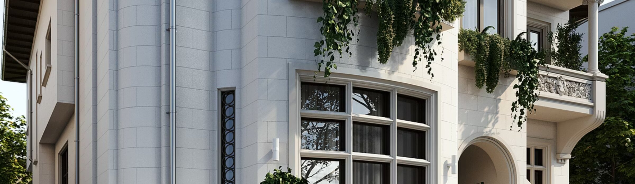 Wide horizontal view of Paris 39's principal façade, showing the stonework, window details, and hanging greenery